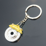 W16362-6Y Féktárcsa alakú kulcstartó féknyereggel - sárga
